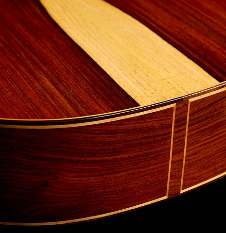 The back and sides at the foot of a 2026 Fructuoso Zalapa "Romanillos" classical guitar made of spruce and cocobolo