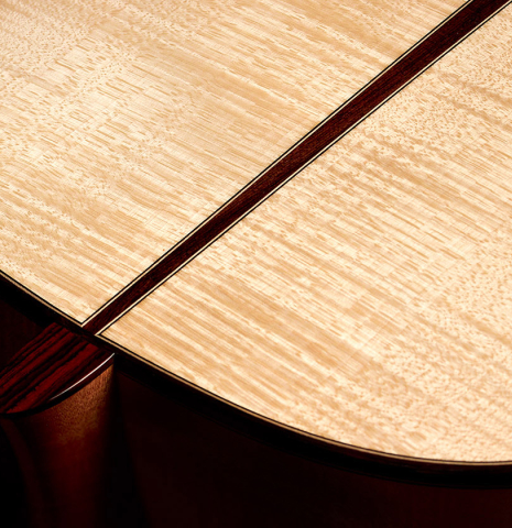 The back and heel of a 2022 Fructuoso Zalapa "Romanillos" classical guitar made of spruce and maple