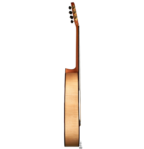 The side of a 2022 Fructuoso Zalapa "Romanillos" classical guitar made of spruce and maple