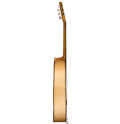 The side of a 2025 Fructuoso Zalapa "Romanillos" classical guitar made of spruce and maple