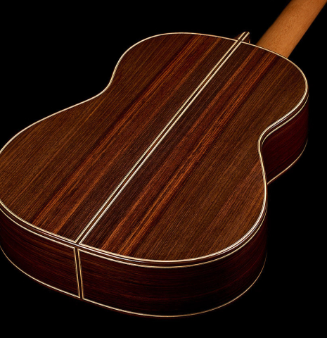 The back and sides of a 2025 Colin van Aelbrouck "Negra" flamenco guitar made of cedar and Indian rosewood