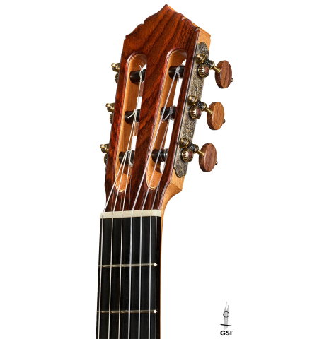 The headstock of a 2025 Colin van Aelbrouck "Negra" flamenco guitar made of cedar and Indian rosewood