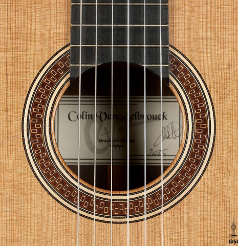 The rosette of a 2025 Colin van Aelbrouck "Negra" flamenco guitar made of cedar and Indian rosewood