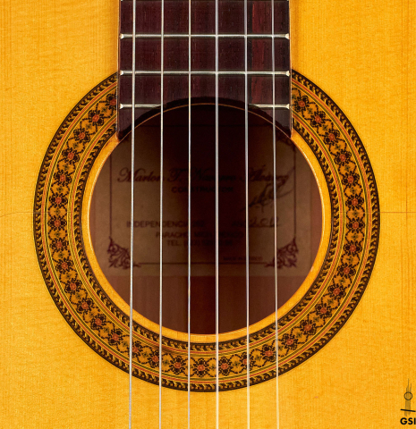The rosette of a 2012 Marlon Navarro Alvarez Student Flamenco guitar made of spruce and cypress