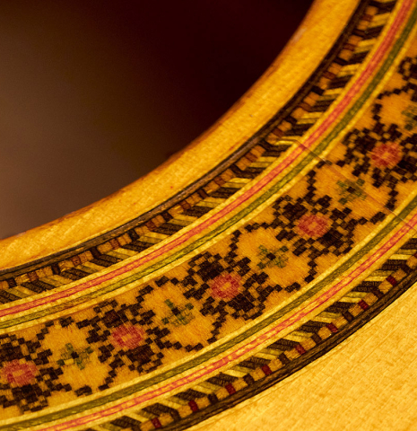 The rosette of a 2012 Marlon Navarro Alvarez Student Flamenco guitar made of spruce and cypress