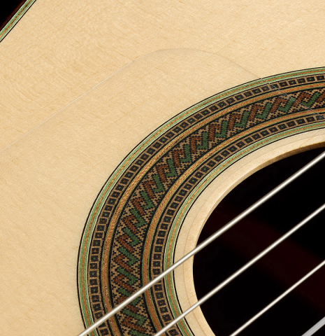 The soundboard and rosette of a 2025 Manuel Arango "Negra" flamenco guitar made of spruce and Indian rosewood