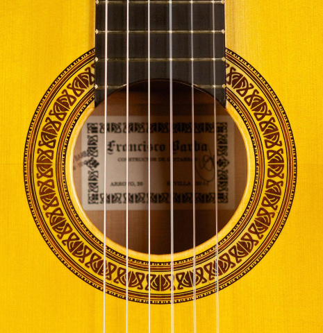The rosette of a 2015 Francisco Barba flamenco guitar made with spruce and cypress
