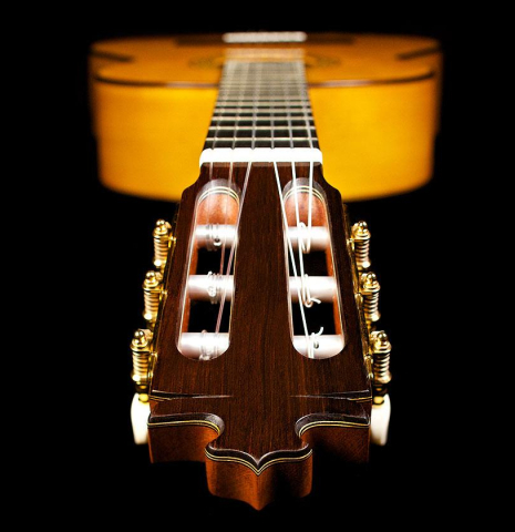 The headstock of a 2015 Francisco Barba flamenco guitar made with spruce and cypress