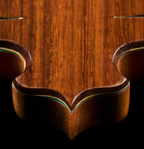 Detail of headstock carving of a 2007 Francisco Barba flamenco guitar made of spruce and cypress