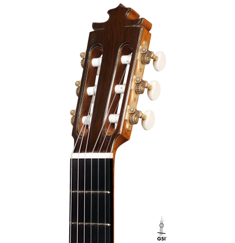 The headstock of a 2016 Francisco Barba CD/MH Flamenco guitar made with cedar top and mahogany back and sides on a white background