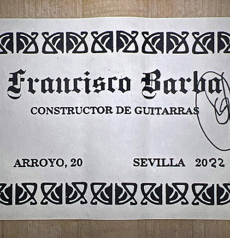 The label of a 2022 Francisco Barba flamenco guitar made of cedar and cypress
