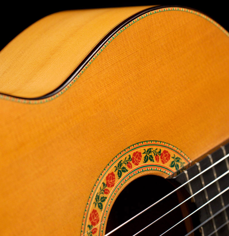 The soundboard and rosette of a 2022 Francisco Barba flamenco guitar made of cedar and cypress