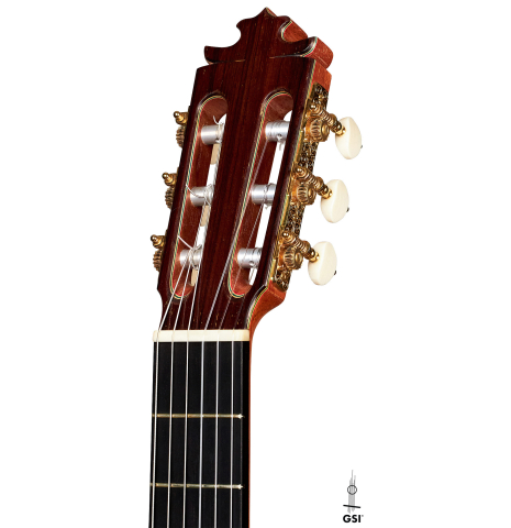 The headstock of a 2015 Francisco Barba flamenco blanca guitar made of spruce and cypress.