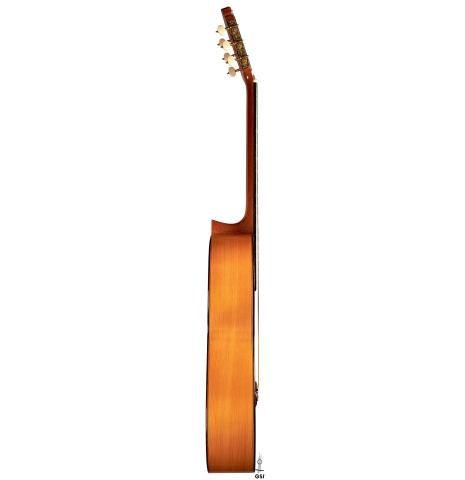 The side of a 2015 Francisco Barba flamenco blanca guitar made of spruce and cypress.