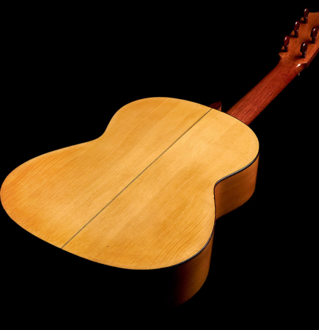 The back of a 1950 Marcelo Barbero flamenco guitar with traditional pegs made of spruce and cypress