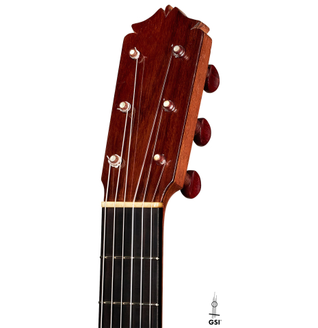 The headstock of a 1950 Marcelo Barbero flamenco guitar with traditional pegs made of spruce and cypress