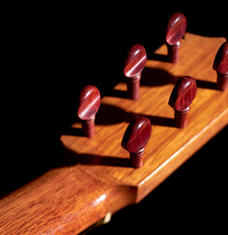 The traditional pegs of a 1950 Marcelo Barbero flamenco guitar made of spruce and cypress