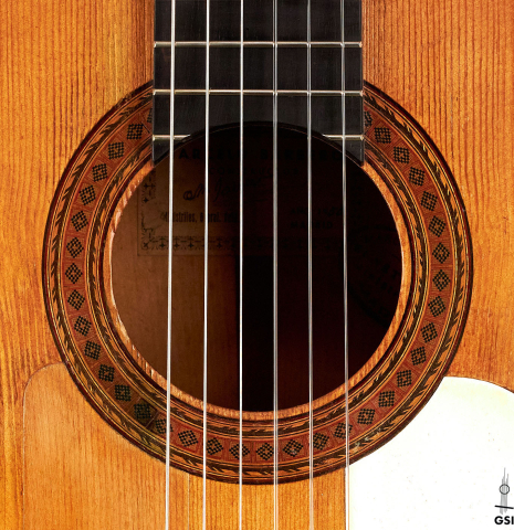 The rosette and sound hole of a 1950 Marcelo Barbero flamenco guitar with traditional pegs made of spruce and cypress