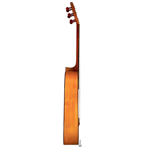 The side of a 1950 Marcelo Barbero flamenco guitar with traditional pegs made of spruce and cypress