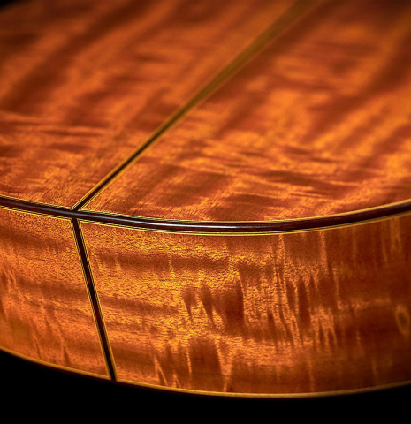 The Mahogany back and sides of a 2021 Francisco Barba CD/MH Flamenco guitar made with cedar top