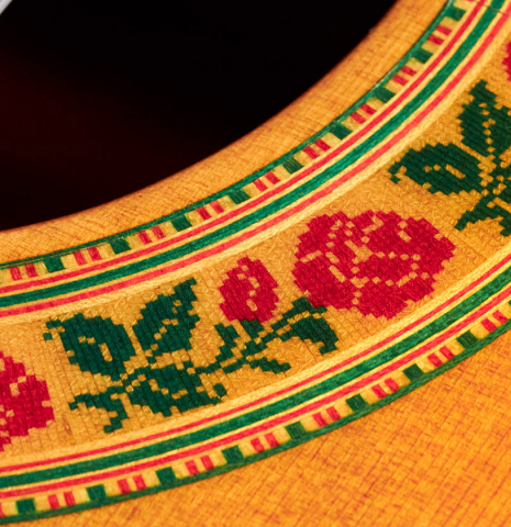 The close-up of a rosette of a 2021 Francisco Barba CD/MH Flamenco guitar made with cedar top and mahogany back and sides