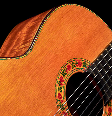 The soundboard and rosette of a 2021 Francisco Barba CD/MH Flamenco guitar made with cedar top and mahogany back and sides