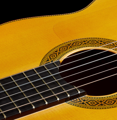 The fingerboard, top and rosette of a 2003 Francisco Barba flamenco guitar made of spruce and cypress