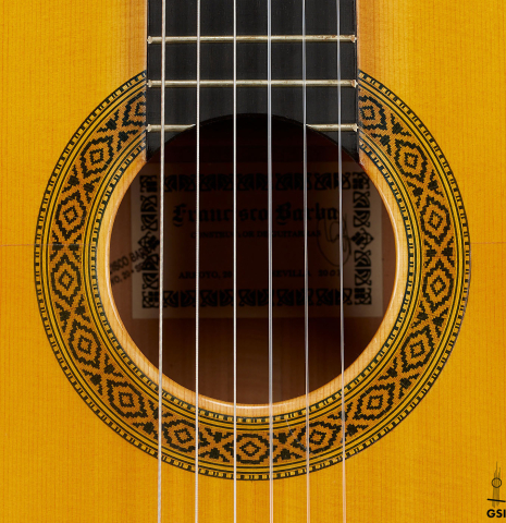The rosette of a 2003 Francisco Barba flamenco guitar made of spruce and cypress