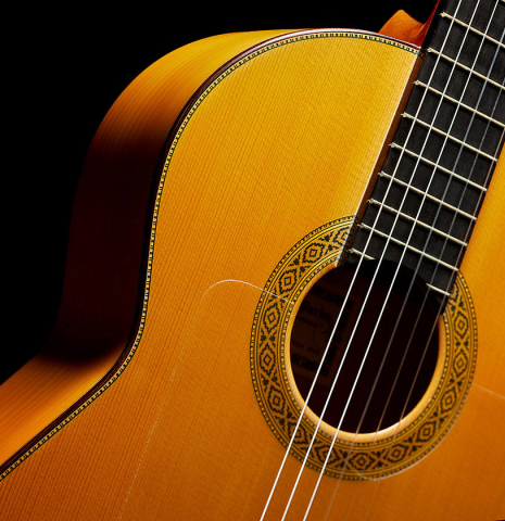 The soundboard and side of a 2003 Francisco Barba flamenco guitar made of spruce and cypress