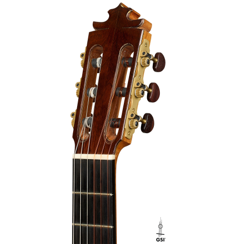 The headstock of a 2003 Francisco Barba flamenco guitar made of spruce and cypress
