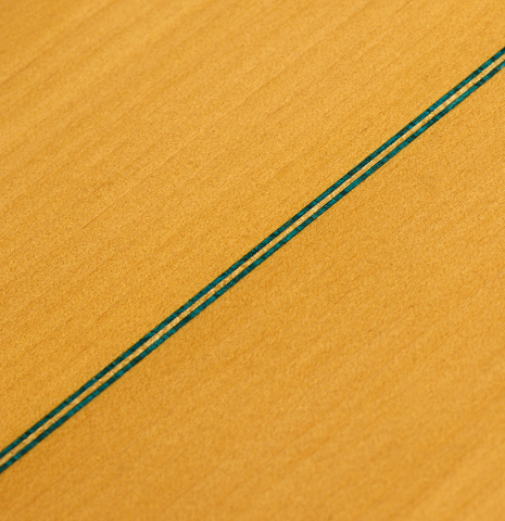 The back center seam of a 1952 Marcelo Barbero flamenco blanca guitar w/pegs made of spruce and cypress