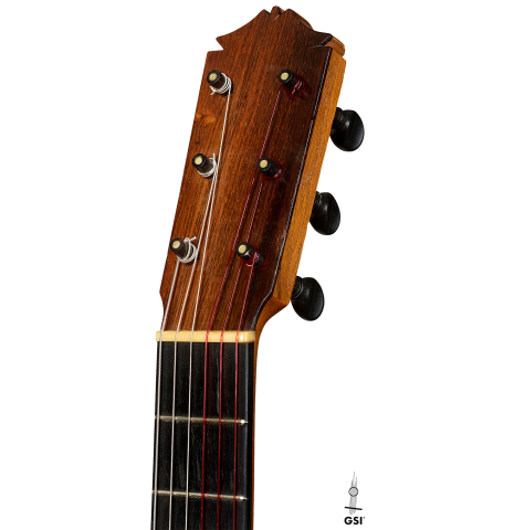 The headstock of a 1952 Marcelo Barbero flamenco blanca guitar w/pegs made of spruce and cypress