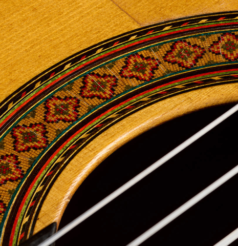 Closeup detail of the rosette of a 1966 Marcelo Barbero (Hijo) flamenco guitar made of spruce and cypress