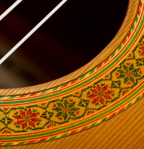 Closeup detail of the rosette of a 1995 Francisco Barba flamenco guitar made of cedar and cypress