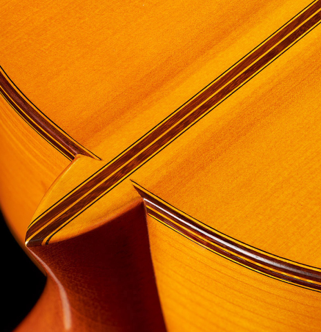 The heel, back, sides and purflings of a 2002 Jose Lopez Bellido 1aF flamenco guitar made of spruce and cypress