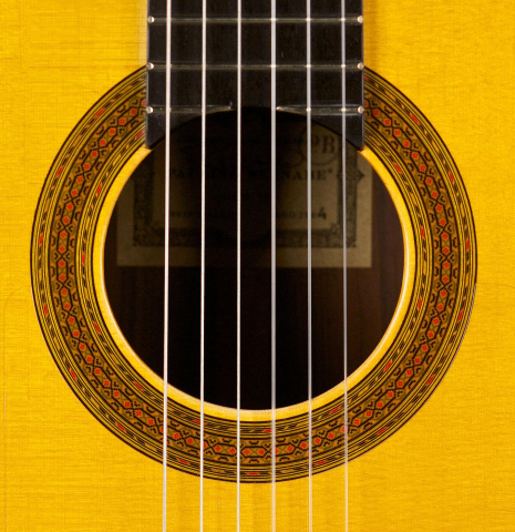 The rosette of a 2004 Paulino Bernabe "Flamenco Negra" flamenco guitar made of spruce and CSA rosewood