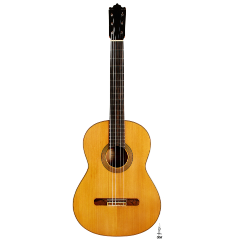 The front of a 1978 Paulino Bernabe "Blanca" flamenco guitar made of cedar and cypress with traditional wooden tuning pegs