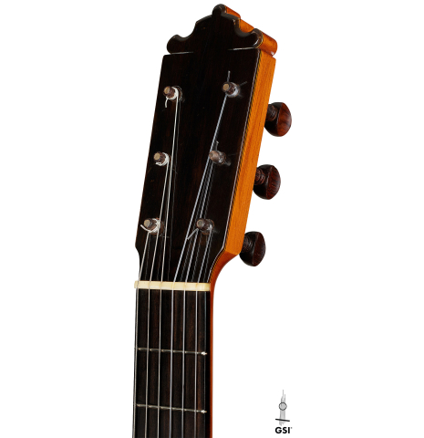 The headstock of a 1978 Paulino Bernabe "Blanca" flamenco guitar made of cedar and cypress with traditional wooden tuning pegs