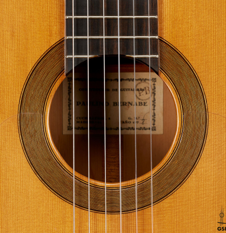 The rosette of a 1978 Paulino Bernabe "Blanca" flamenco guitar made of cedar and cypress with traditional wooden tuning pegs