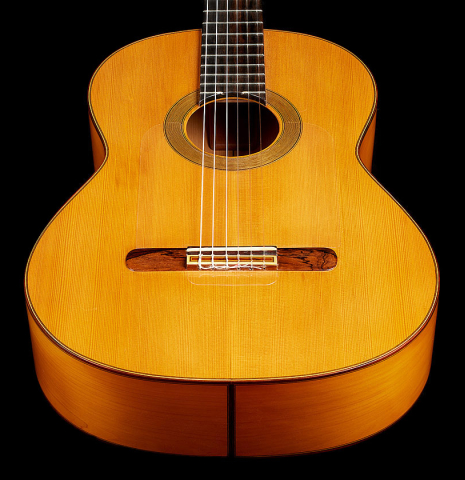 The soundboard of a 1978 Paulino Bernabe "Blanca" flamenco guitar made of cedar and cypress with traditional wooden tuning pegs