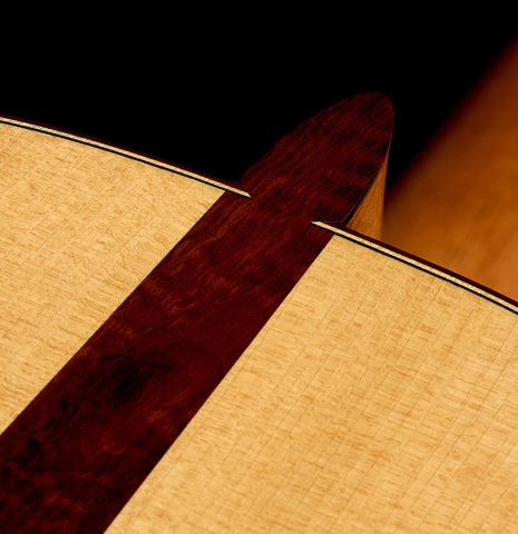 The heel, back binding, purfling and snakewood wedge of a 2026 Jakob Biehler "Flamenca Blanca" with pegs made of spruce and cypress