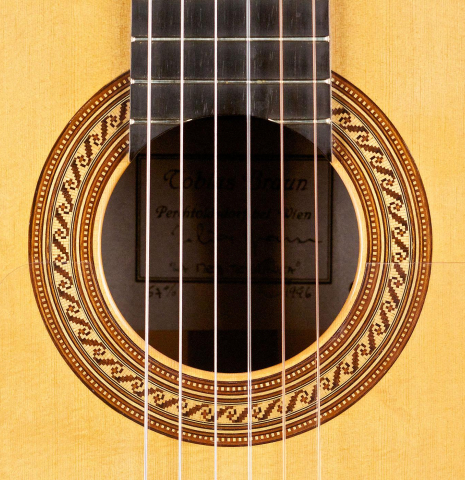 The rosette of a 1996 Tobias Braun flamenco blanca guitar made of spruce and cypress
