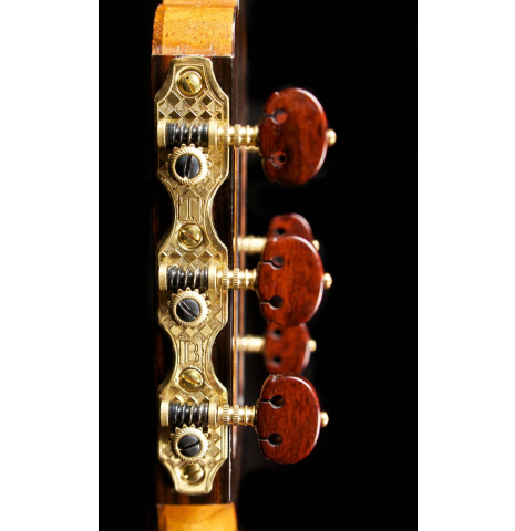 The tuning machines of a 1996 Tobias Braun flamenco blanca guitar made of spruce and cypress