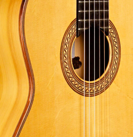 The top and side of a 1996 Tobias Braun flamenco blanca guitar made of spruce and cypress