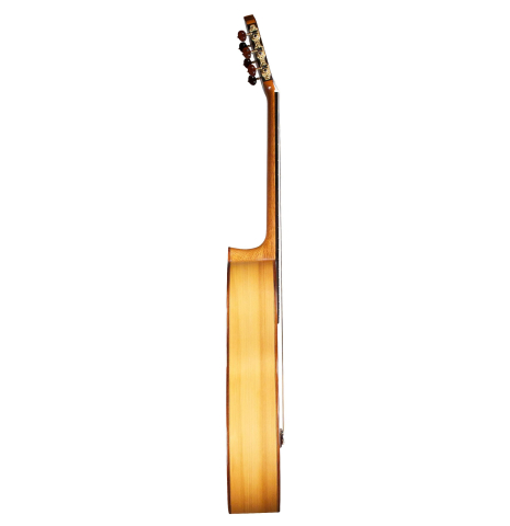 The side of a 1996 Tobias Braun flamenco blanca guitar made of spruce and cypress