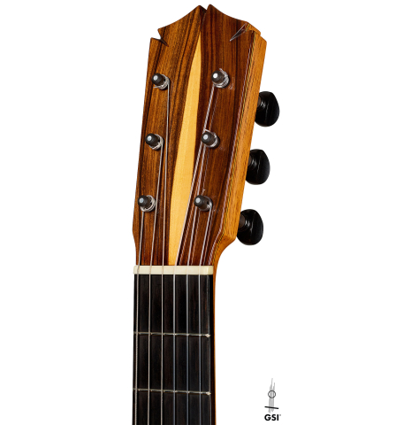 The headstock of a 2012 Ron Bushman w/pegs flamenco guitar made of spruce and cypress