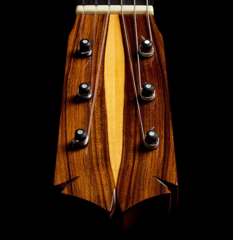 The headstock with traditional tuning pegs of a 2012 Ron Bushman w/pegs flamenco guitar made of spruce and cypress