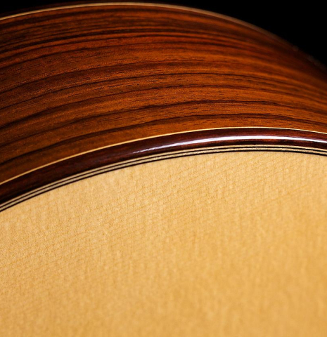 The soundboard and side of a Hermanos Camps "Primera Negra" flamenco guitar made of spruce and Indian rosewood