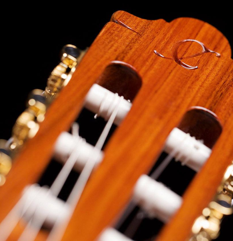 The headstock and machine heads of a Hermanos Camps &quot;FL11C Blanca&quot; flamenco guitar made of spruce and cypress