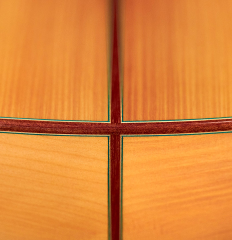 The cypress back and sides of a 2022 Vicente Carrillo "1aF Blanca" flamenco guitar made with spruce top